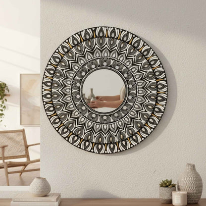 2ft round mandala mirror with intricate patterns on a wall in a room.