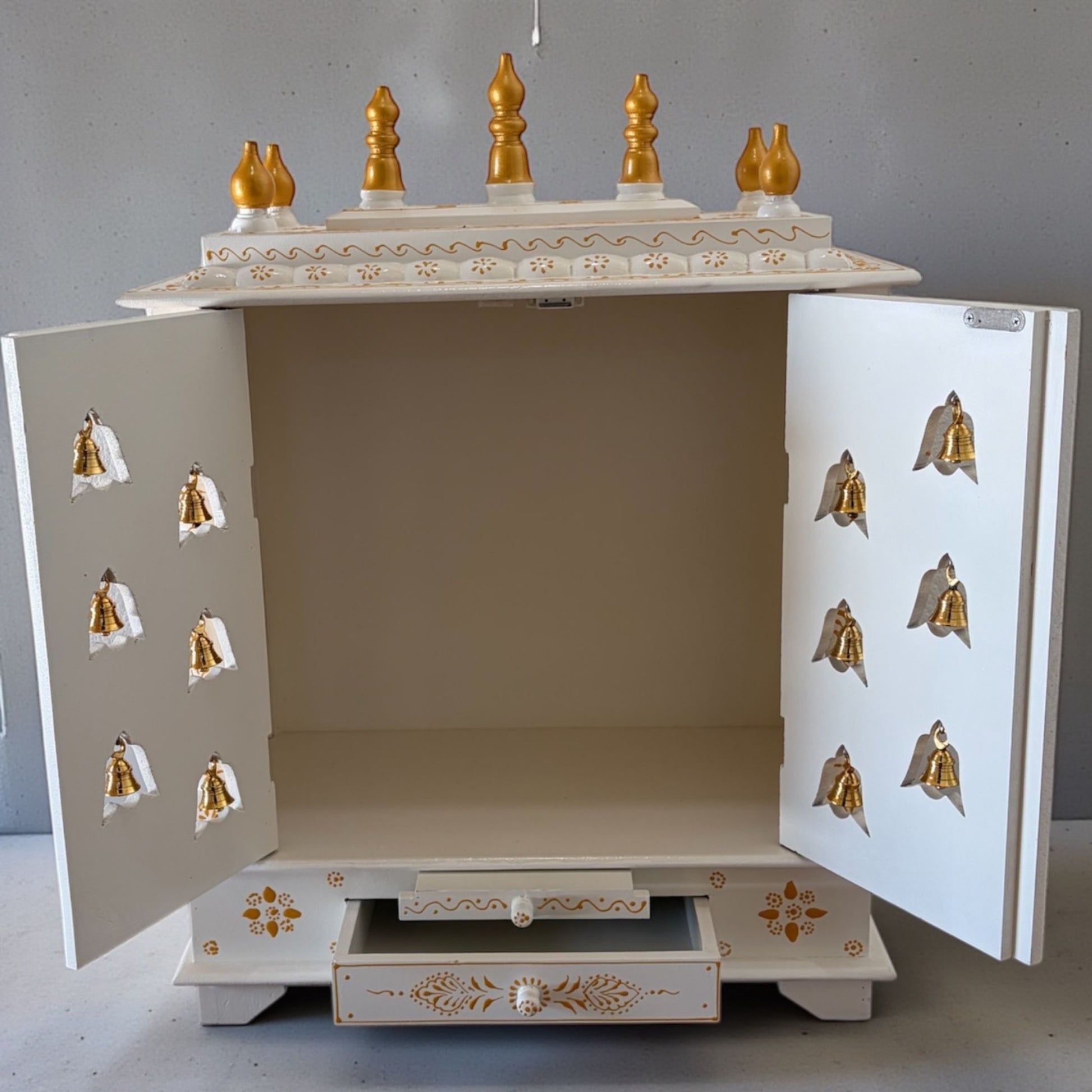 White Temple with Brass Bells & Doors - Interior view of the white and gold temple with ample space for idols and decorative items