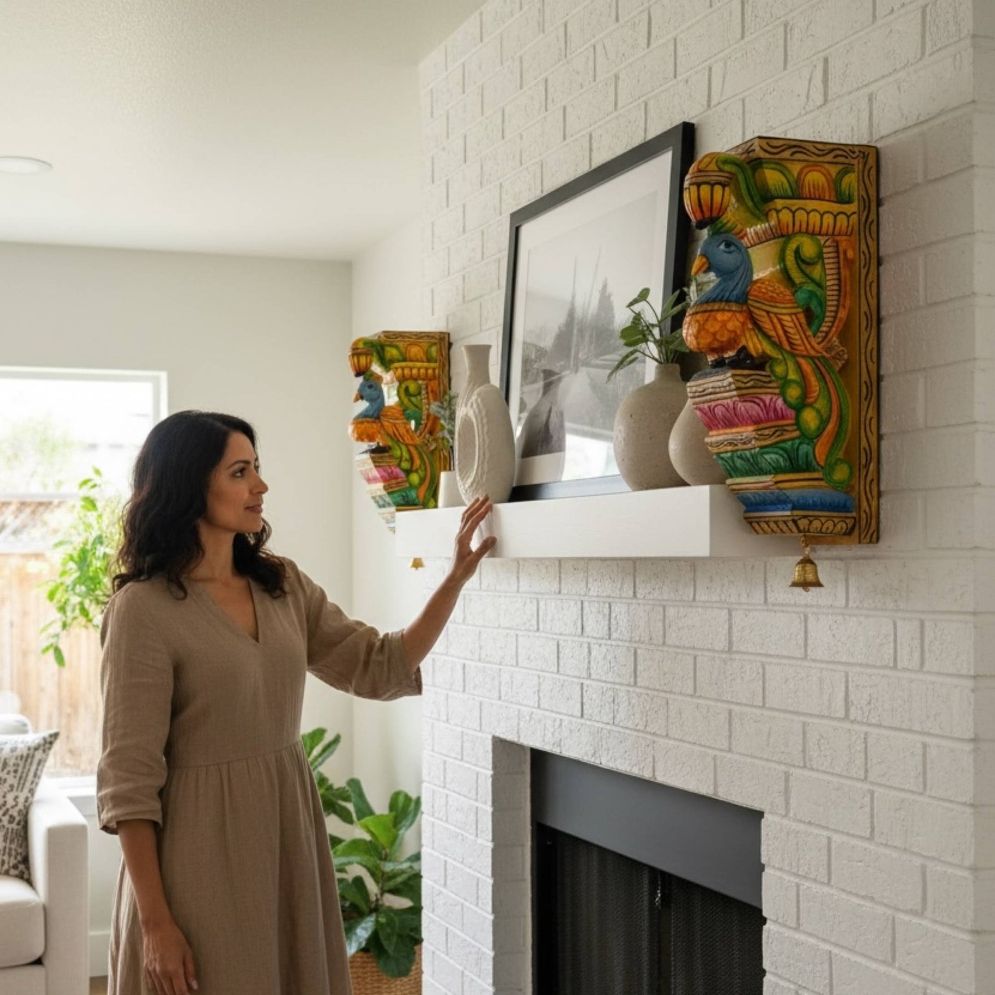 Front view of a 12-inch hand-carved wooden peacock corbel with an authentic hanging brass bell.
