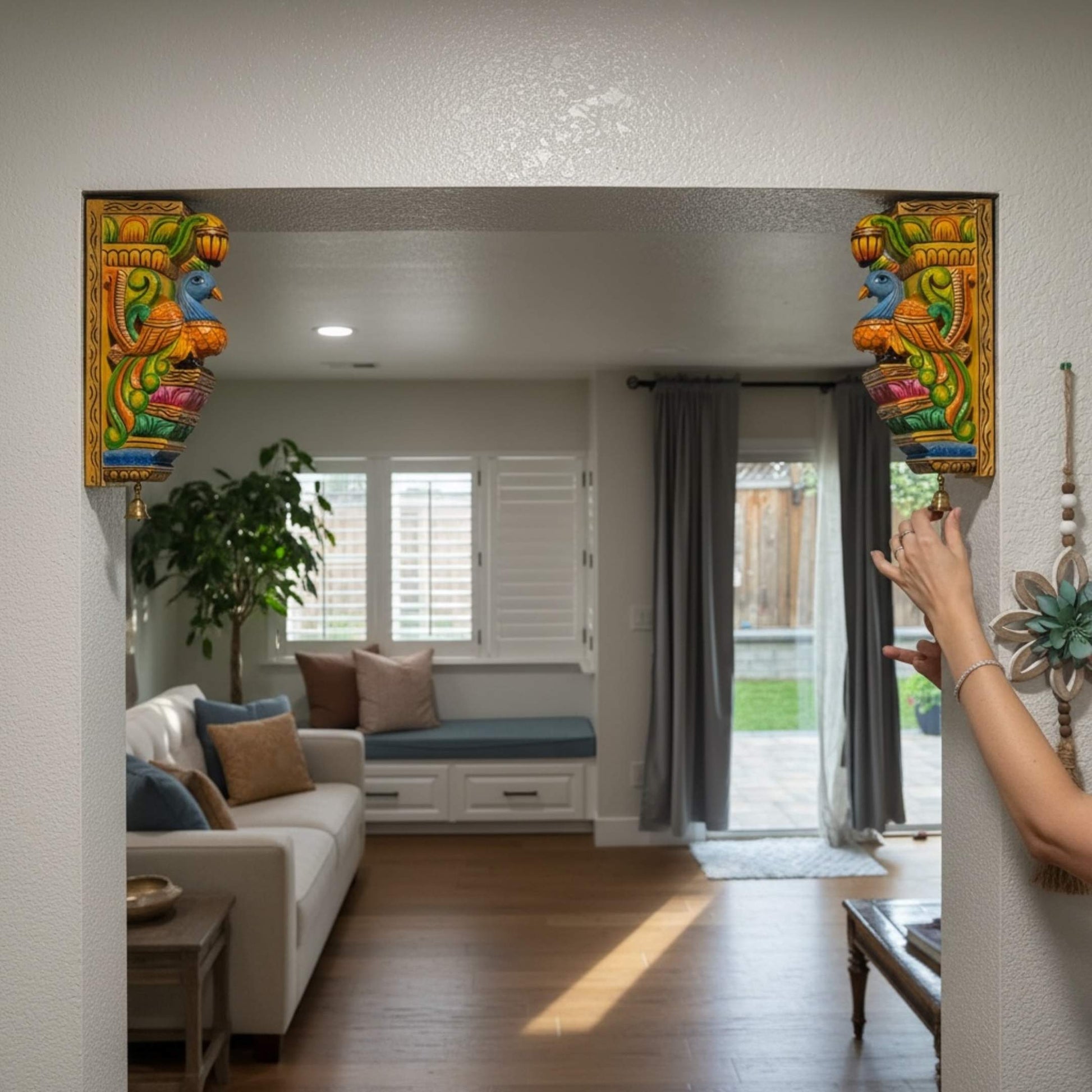 Traditional Indian wall decor featuring a pair of hand-carved wooden corbels  in a modern living room.