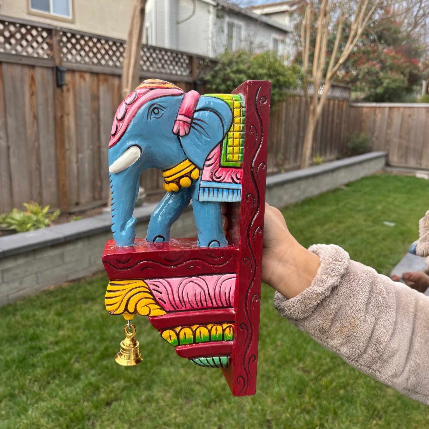 Handcrafted 12-inch elephant wall corbel showing the scale and rich texture of the hand-carved mango wood.